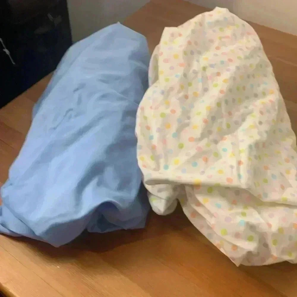 Two crib sheets, both in excellent used condition.